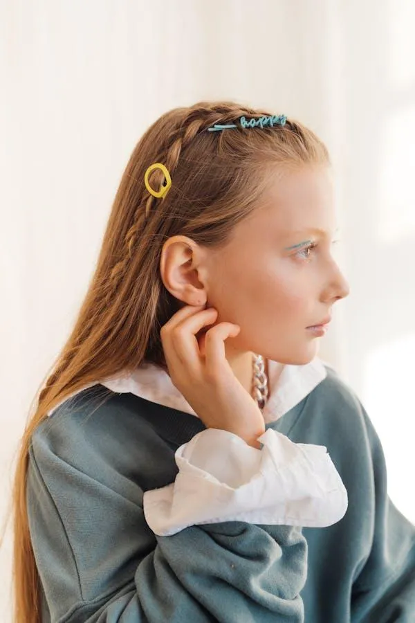 Profile of Woman with Hair Clips Looking Sideways Wallpaper