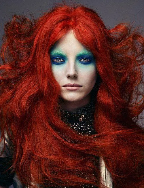 Red Haired Model with Bold Makeup in High Fashion Concept