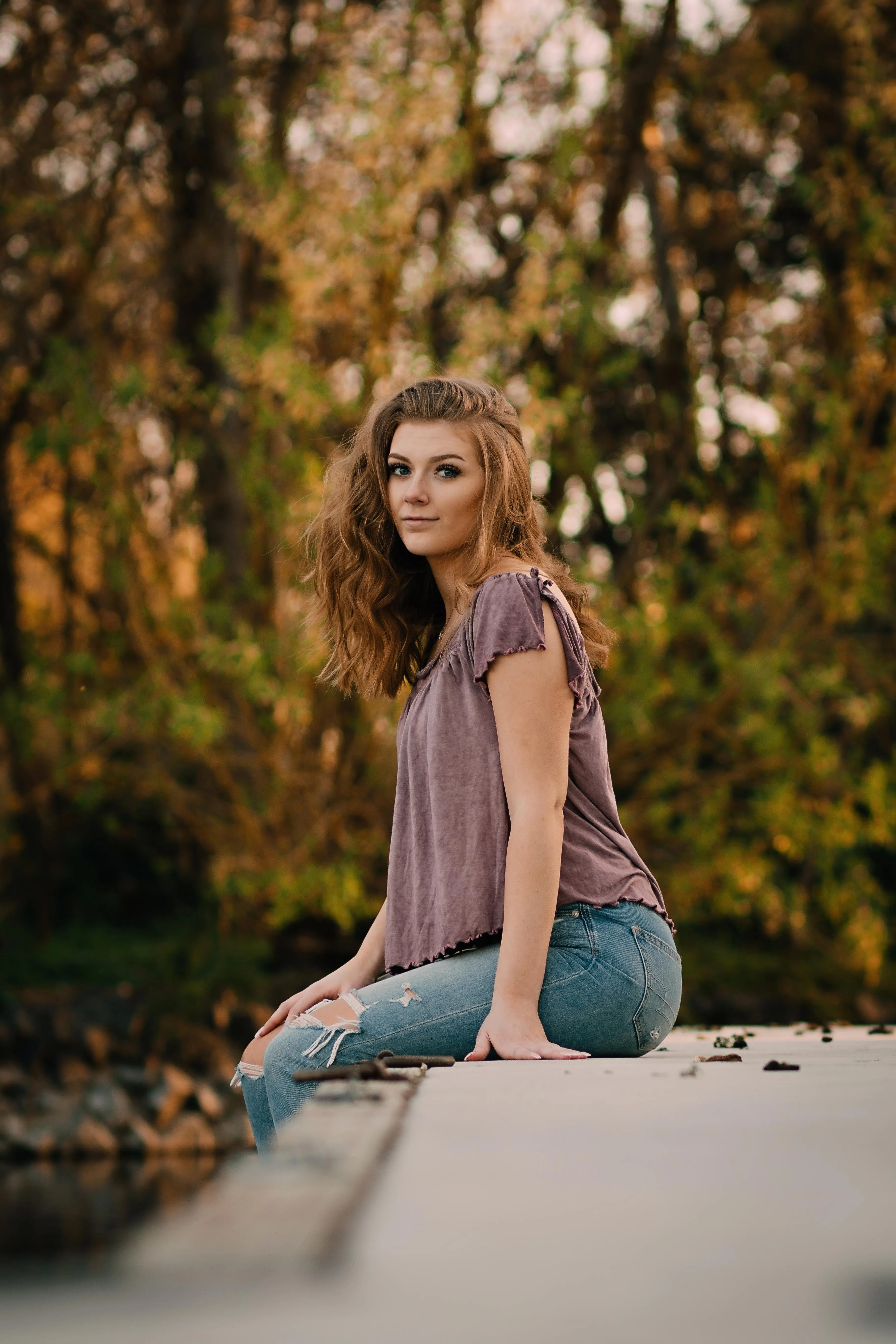 Relaxed Woman Lounges in a Desert Landscape with Warm Light