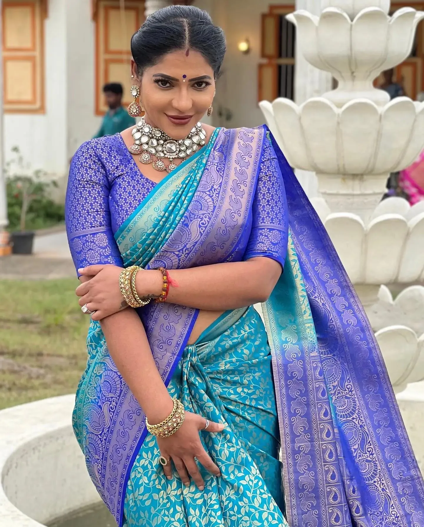 Reshma Pasupuleti in Blue Saree Seated Outdoors Calmly Image