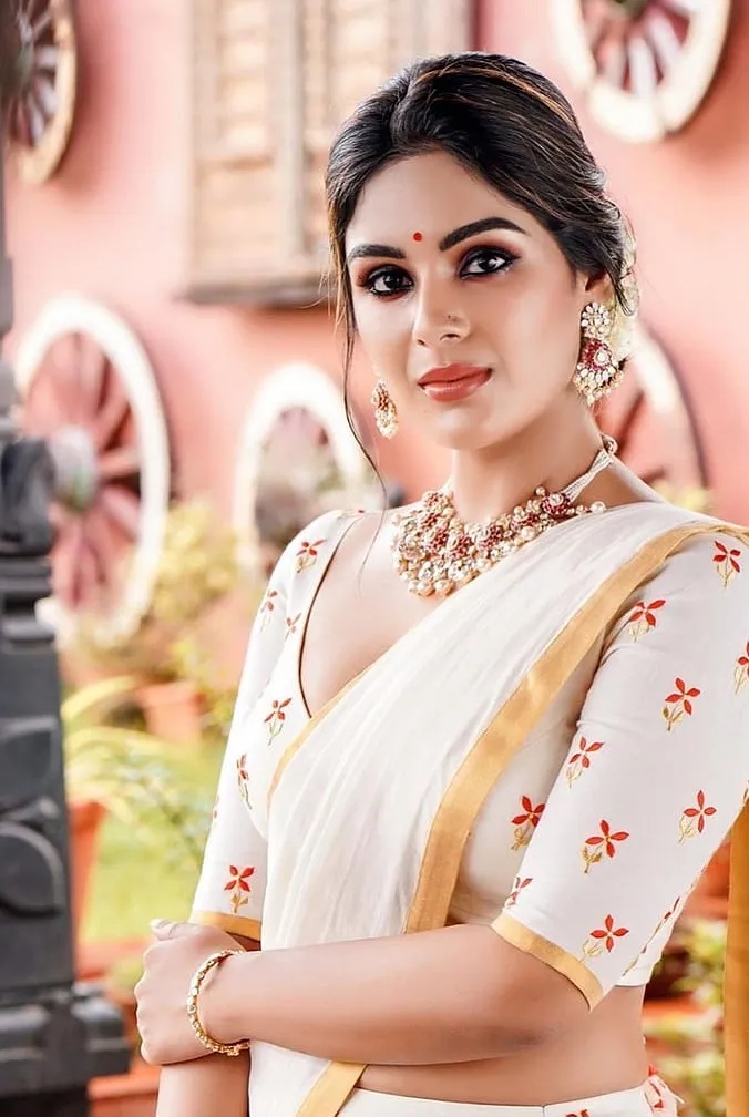 Samyuktha Menon in a saree with looking at the camera image