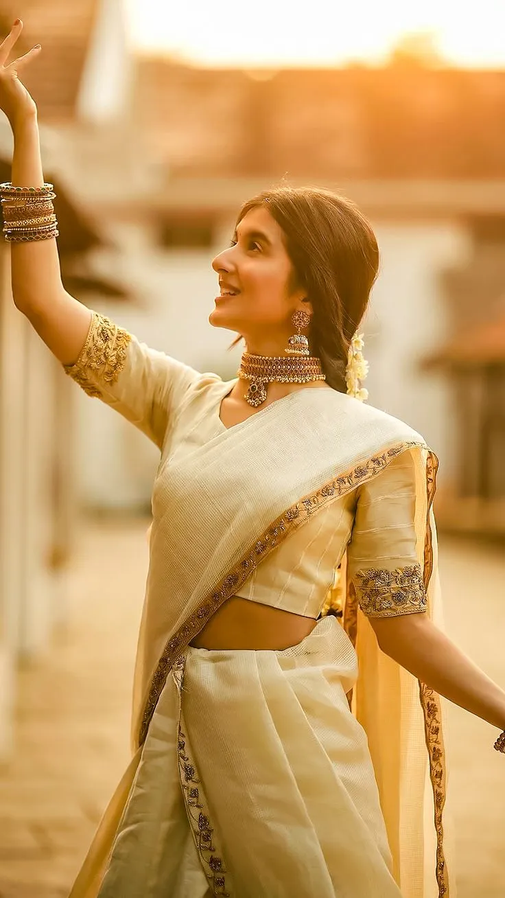 Sanjana Sarathy in a white saree with a stylish pose image