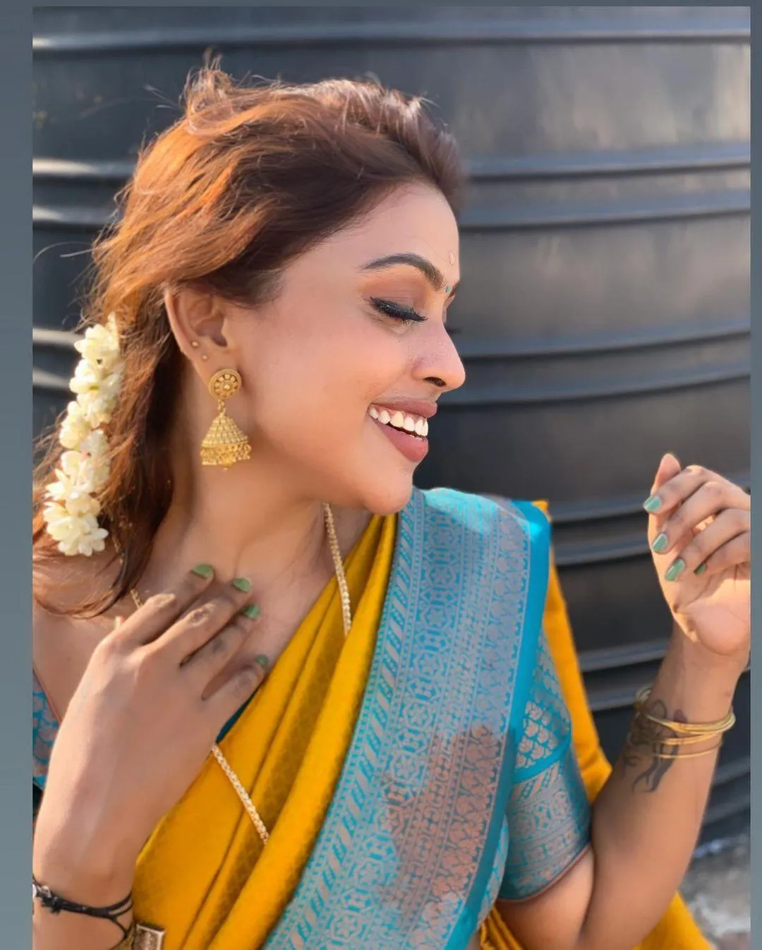 Sensual Sri Nikha in Yellow Saree with Joyful Smile Picture