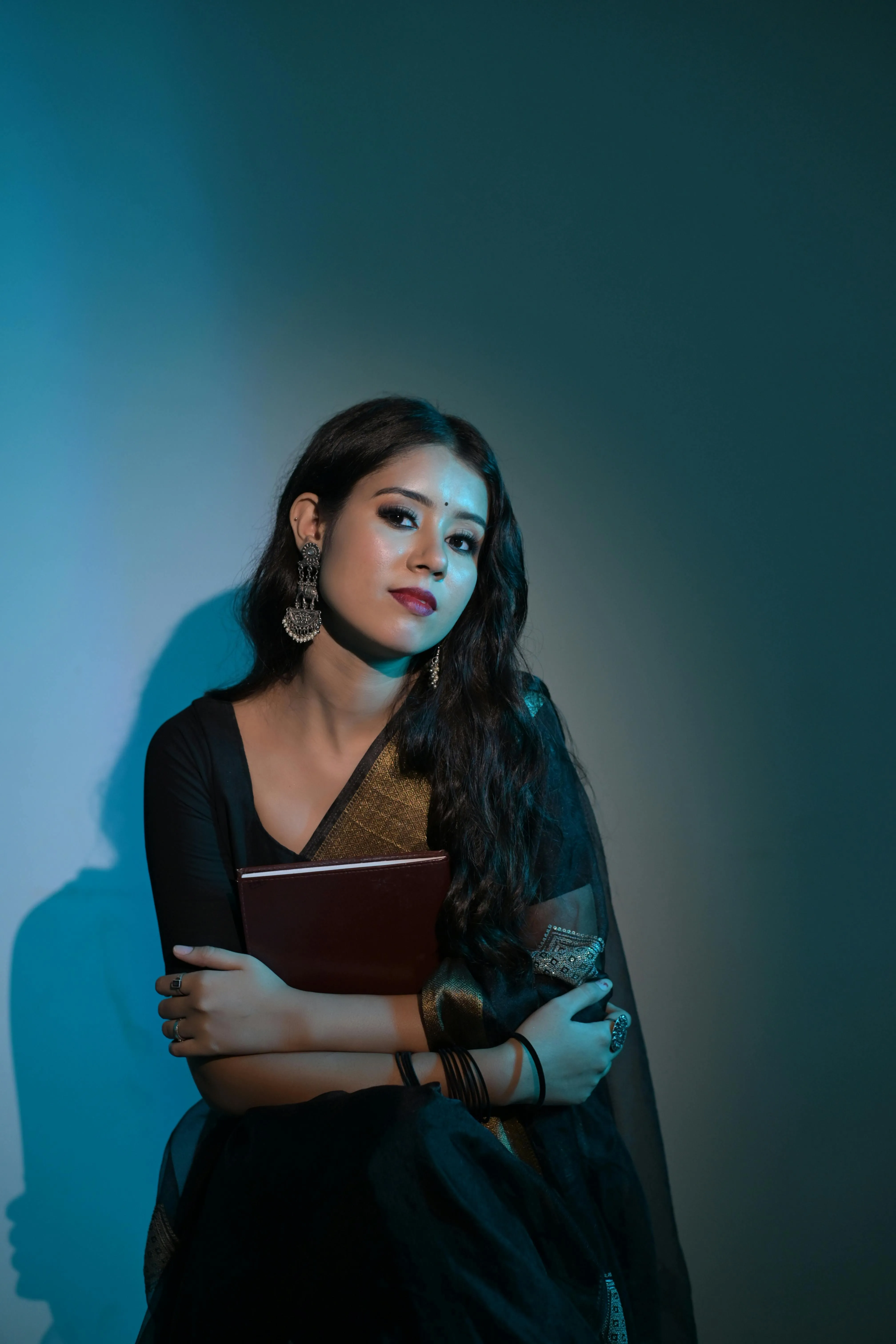 Sensual Young Woman in Black Saree Modern Indoor Pose Image