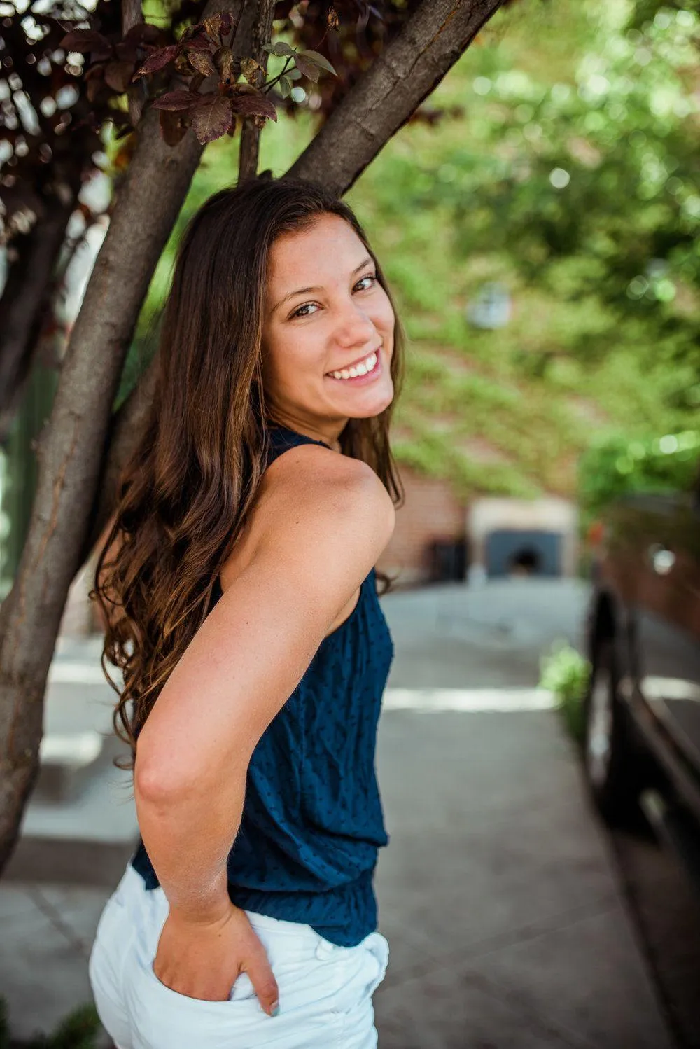 Smiling Girl Posing Confidently Outdoors in a Summer Top