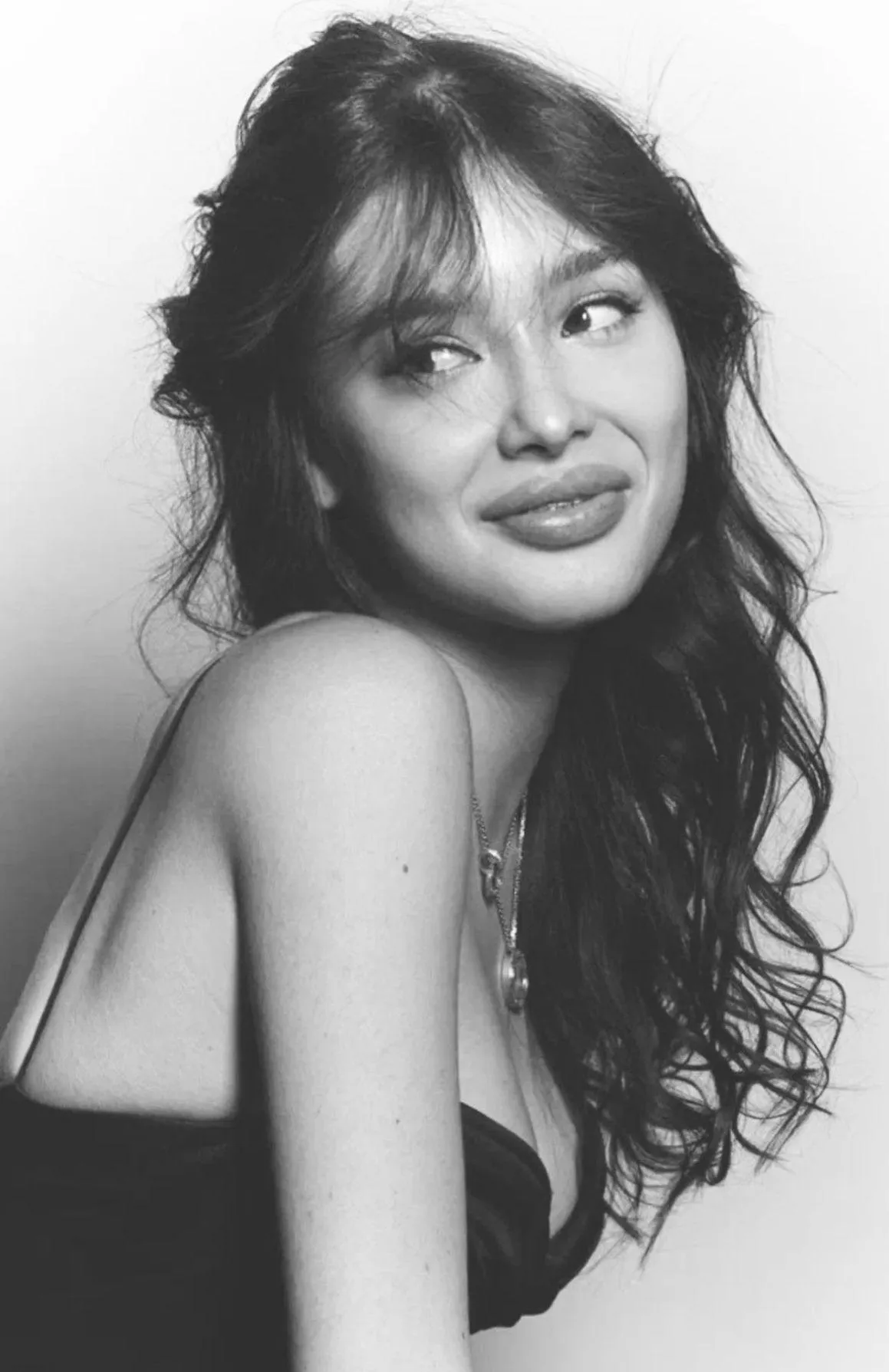 Smiling Woman in Black and White Portrait Looking Playful