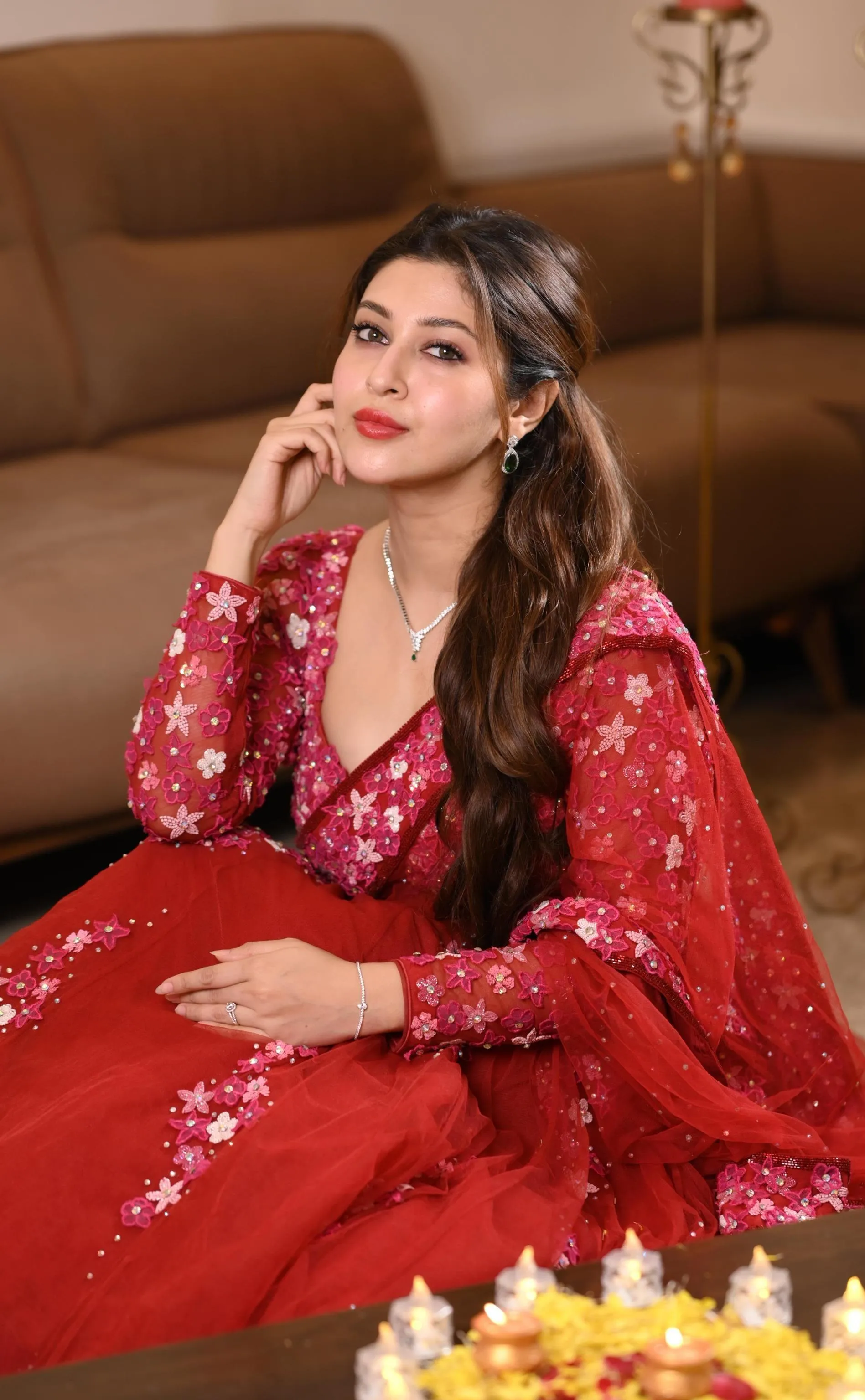 Sonarika Bhadoria in Red Dress Sitting with Elegance Picture