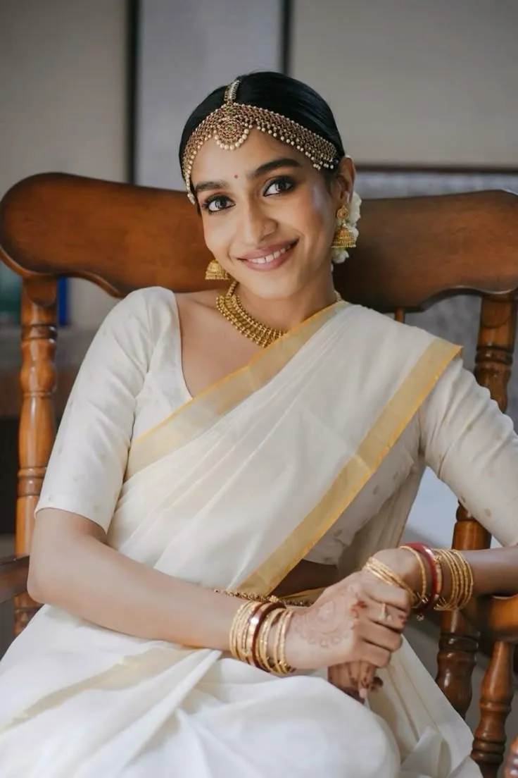 Stunning image of a cute woman sitting on a wooden chair