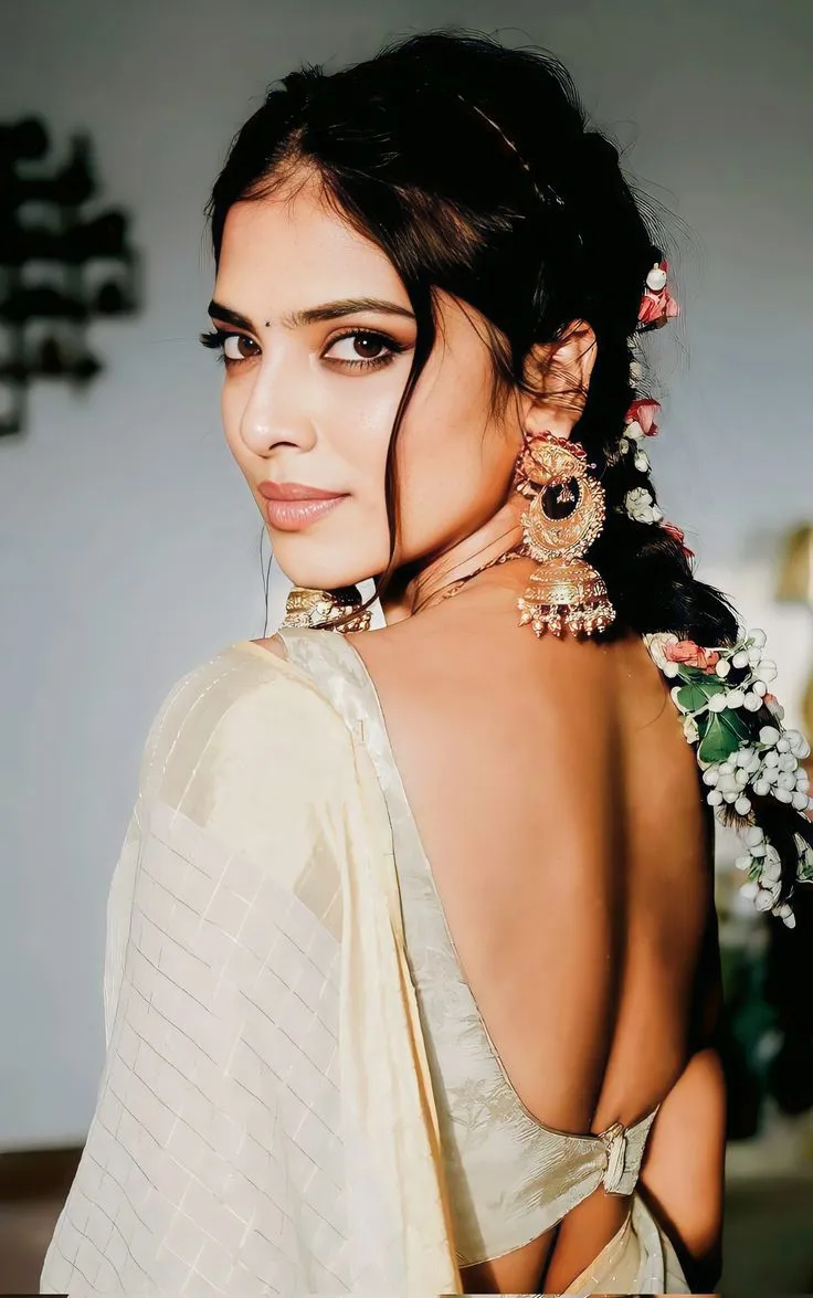 Stunning image of Malavika Mohanan with a looking back pose