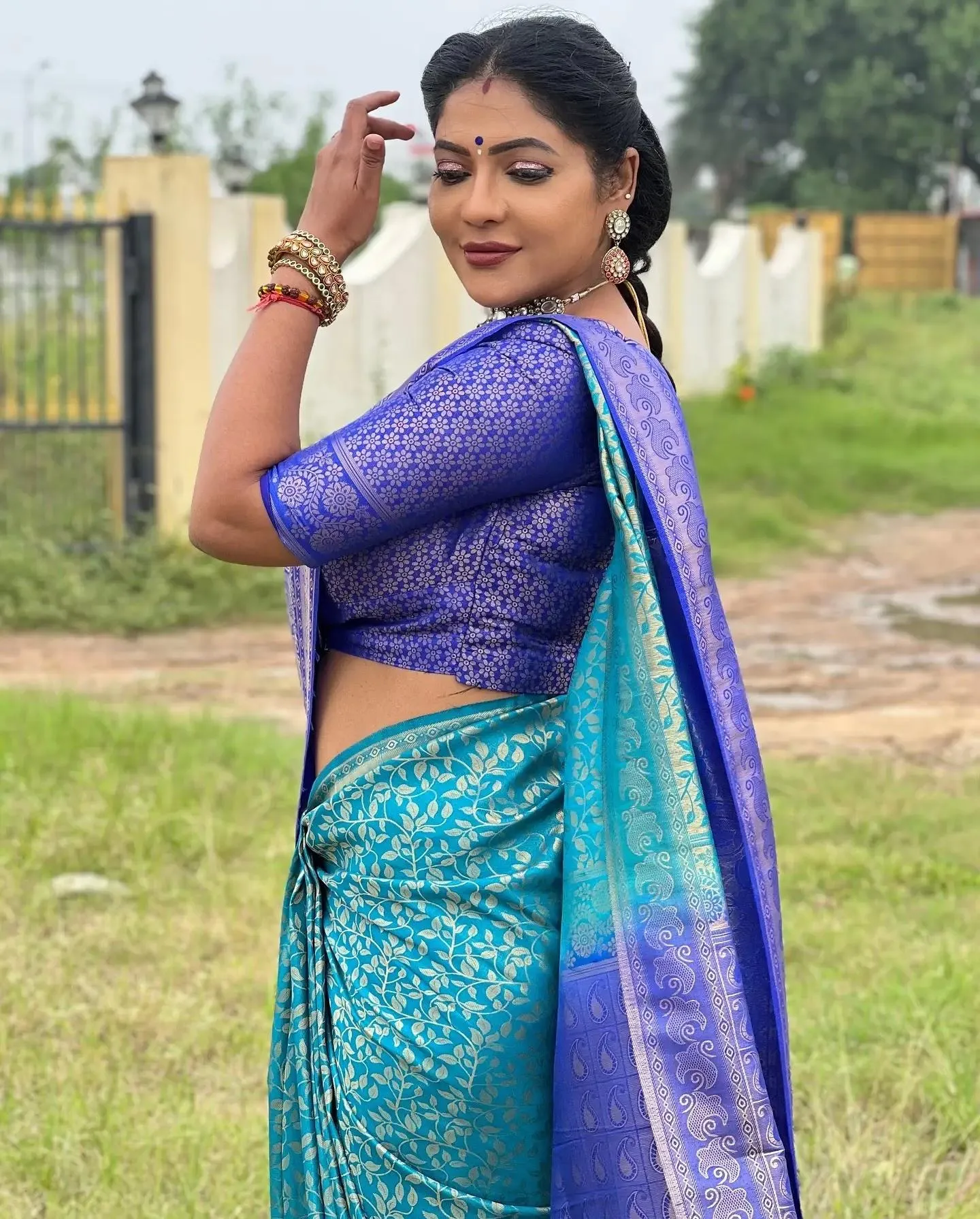 Stunning Reshma Pasupuleti in Purple Saree Casual Pose Photo