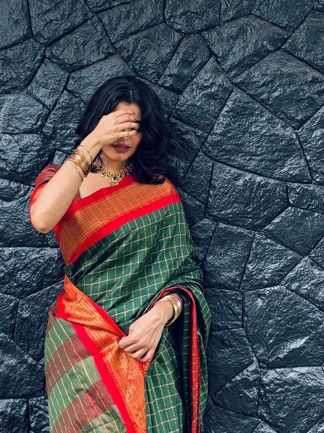 Stunning Sandra Chaandy in Red Saree Outdoor Pose Wallpaper
