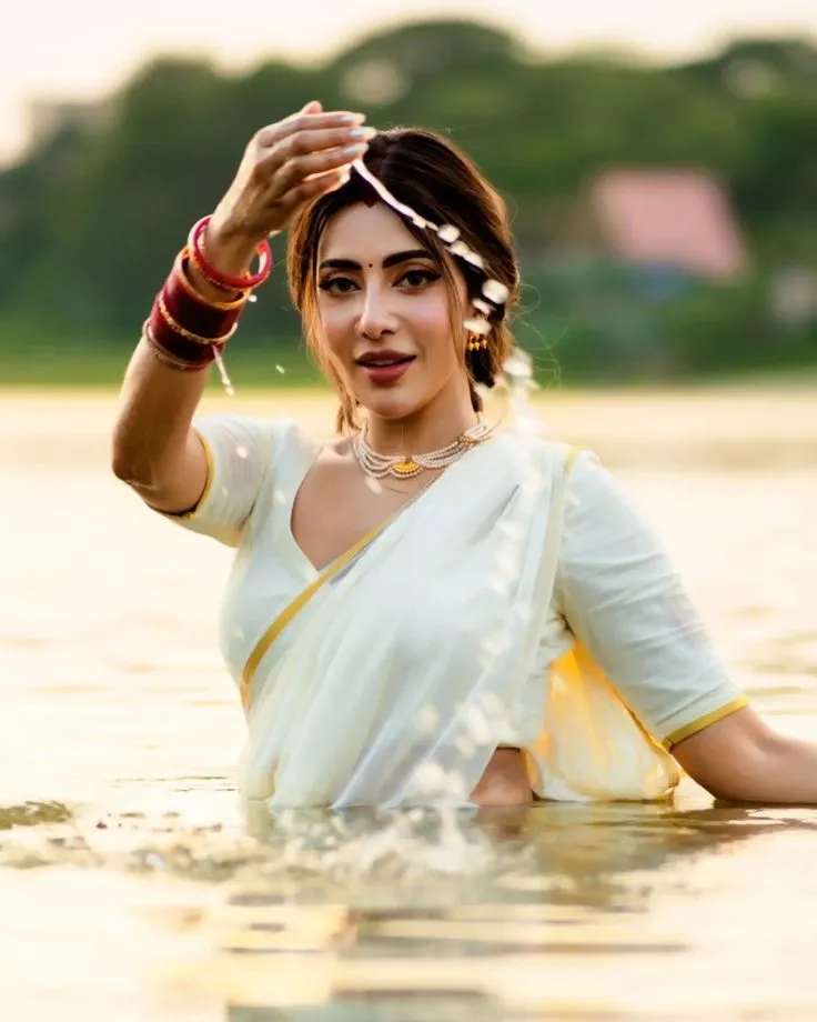 Stunning wallpaper of a woman standing in water wallpaper