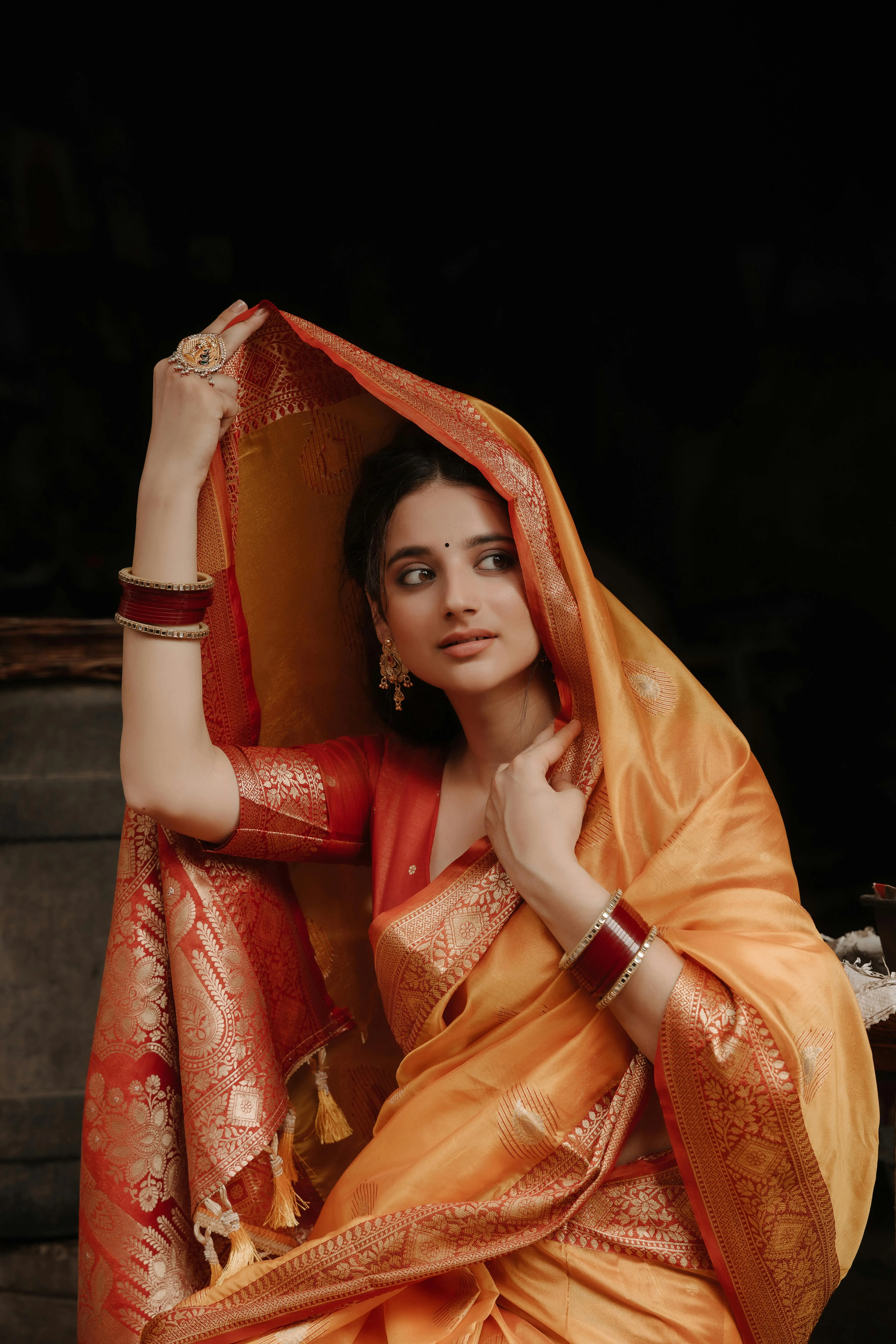 Stunning Young Woman in Orange Saree Artistic Dance Pose