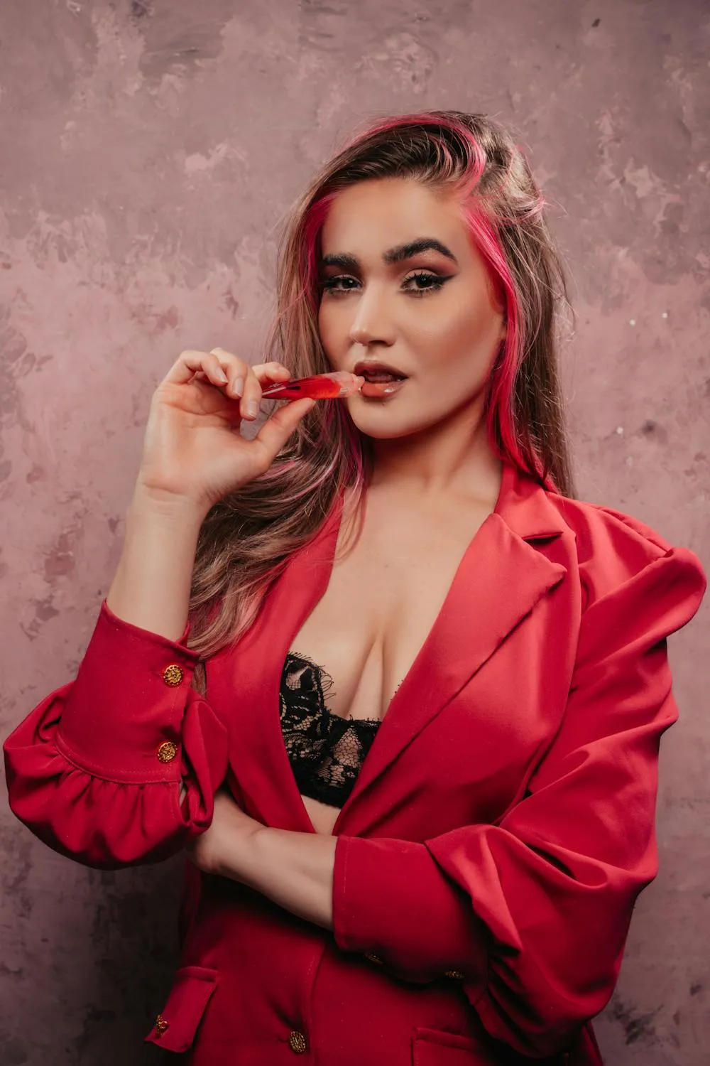 Stylish Model in a Red Jacket with a Black Lace Outfit Pose