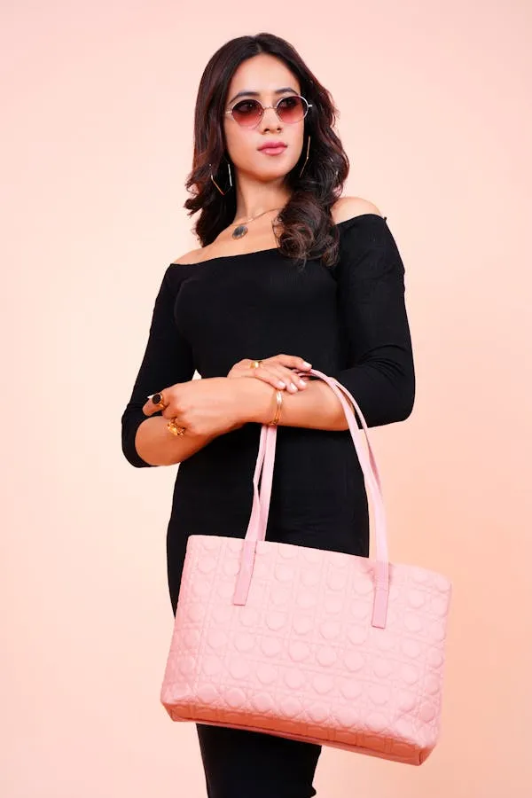 Stylish Woman with Black Dress Holding a Pink Bag Outdoors