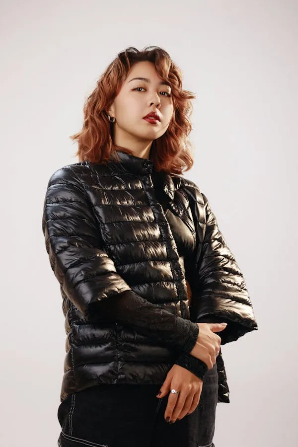 Stylish Woman in a Black Jacket Posing with Confident Look