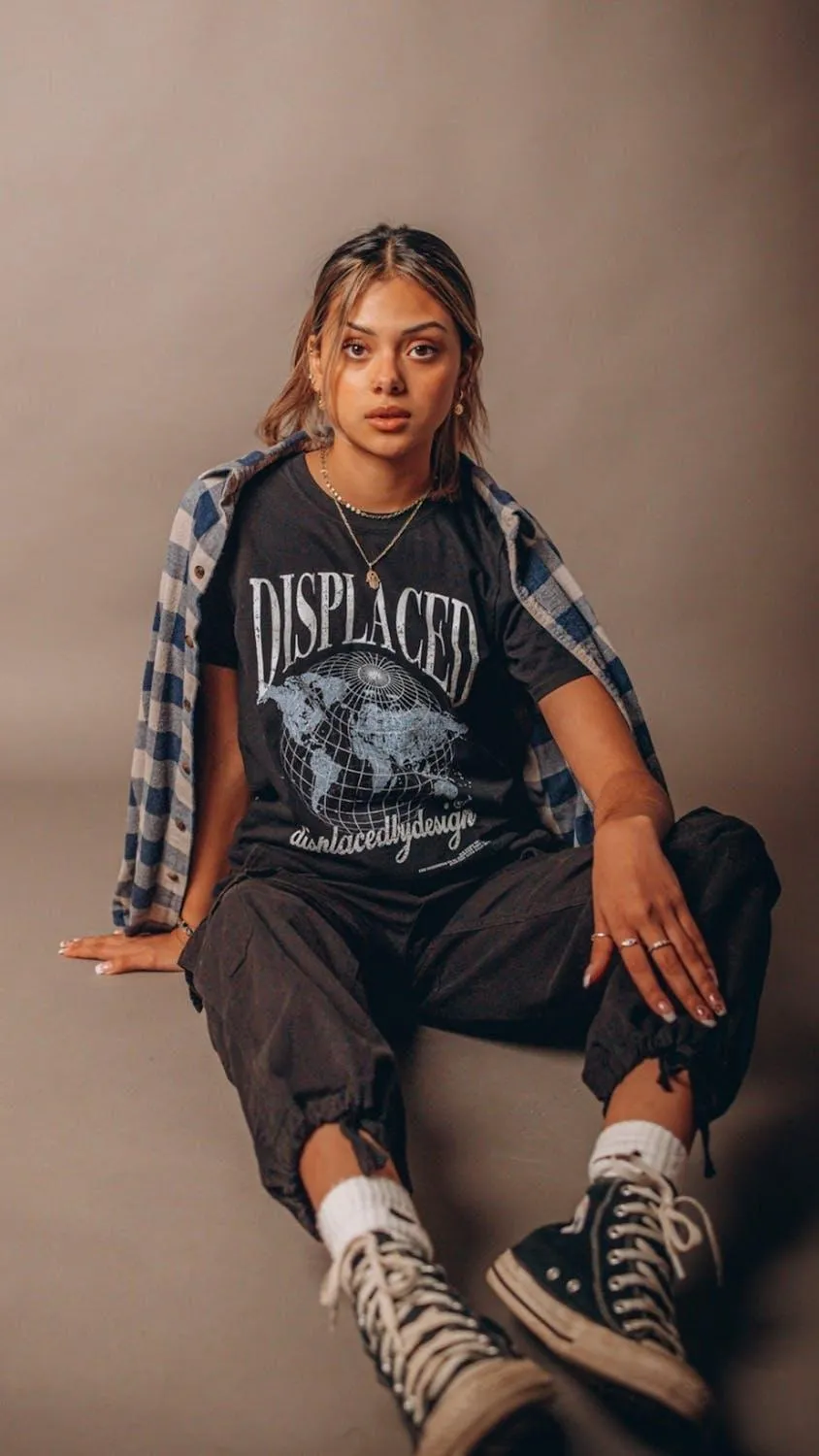 Stylish Woman in Casual Streetwear Posing with Confidence