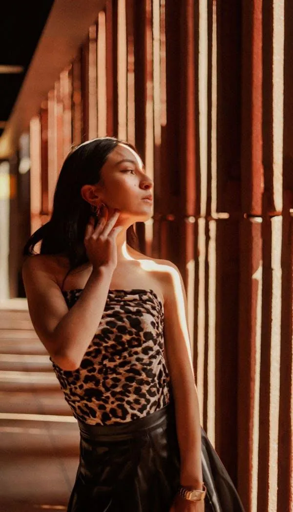 Stylish Woman Leaning on the Railing and Wearing Sunglasses