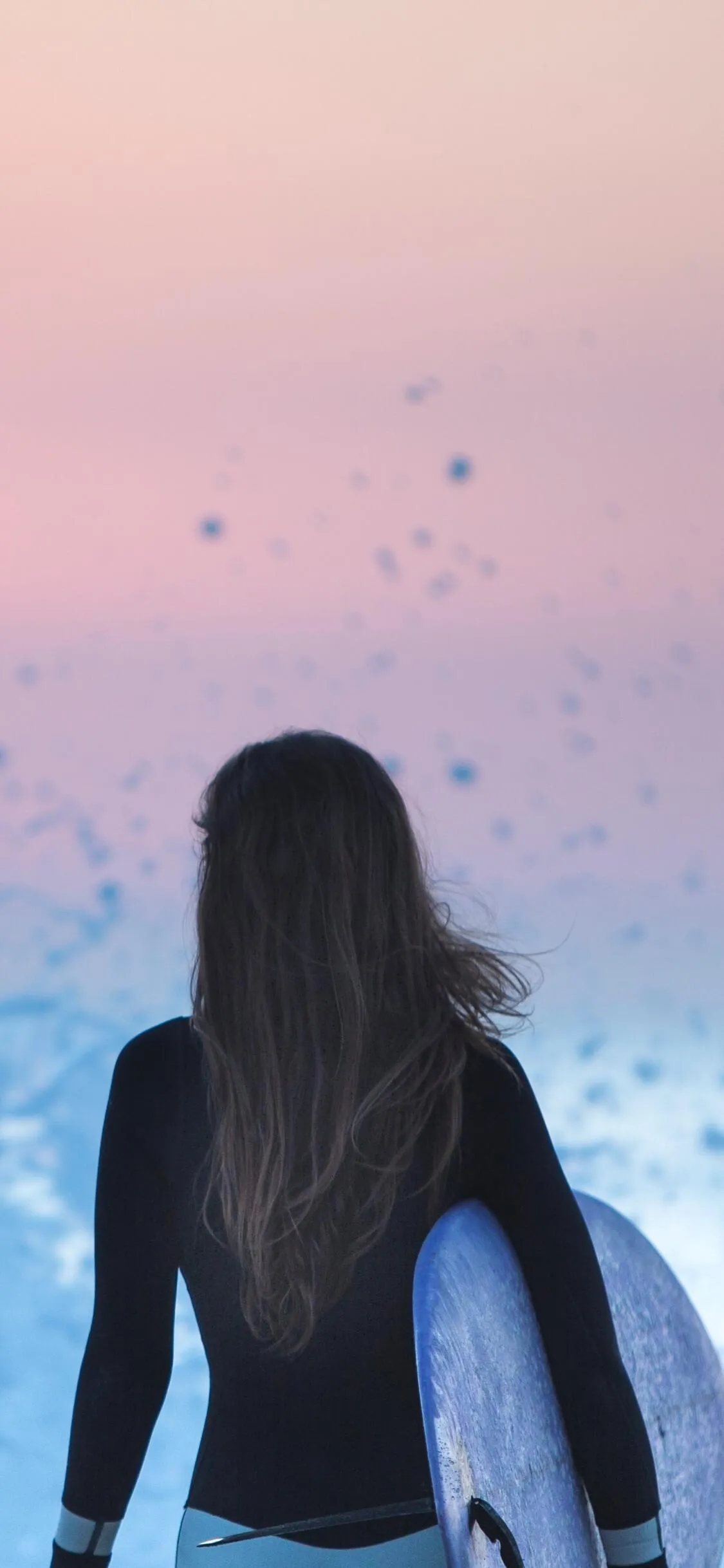 Stylish Woman Sits on Leaves in an Autumn Forest Walkway