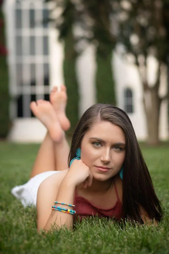 Surfer Girl Catches a Glowing Wave During Sunset Wallpaper