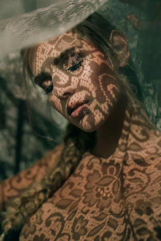 Tattooed Man Leaning Back with Intense Artistic Expression