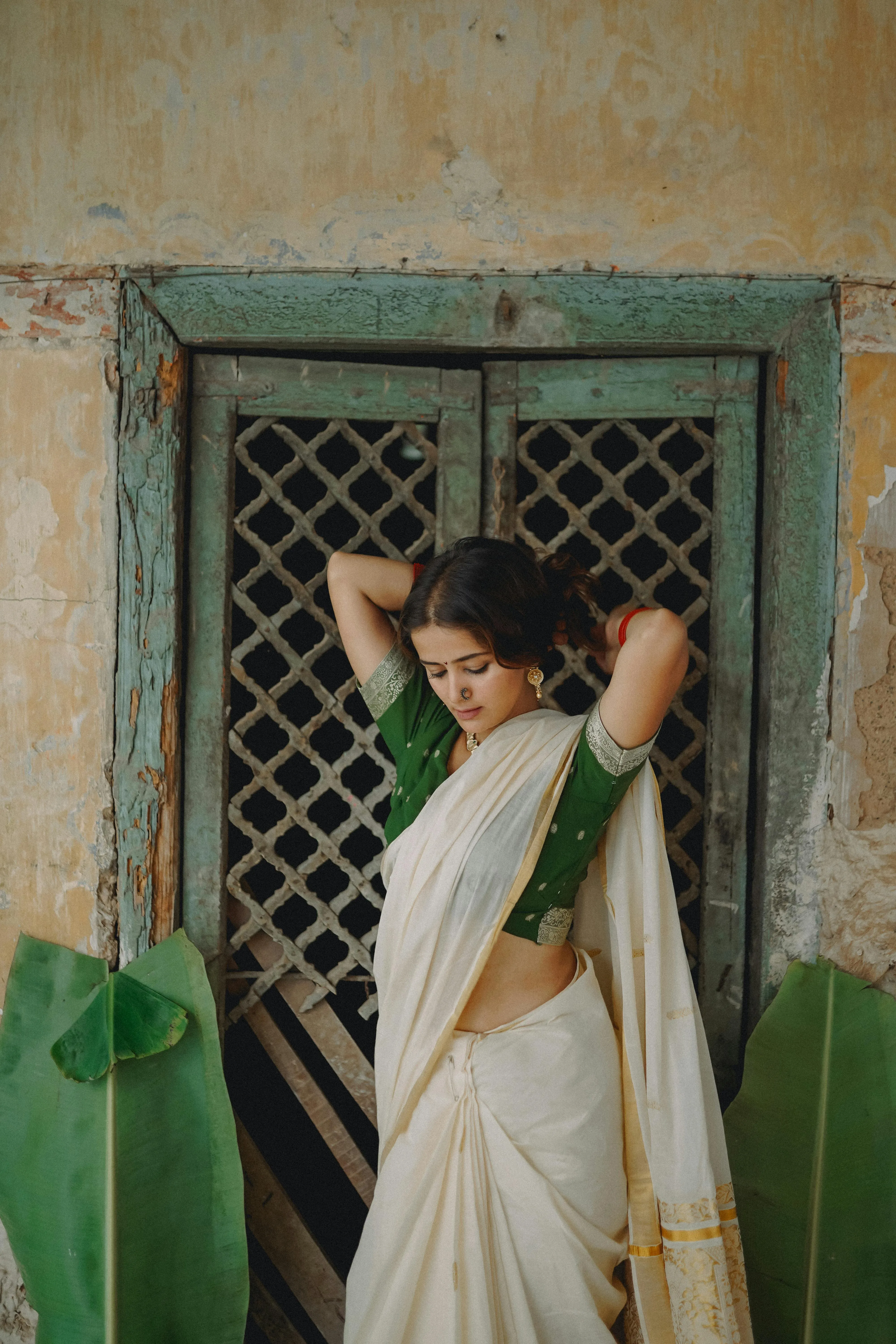 Tempting Young Woman in White Saree Near Wooden Window Image