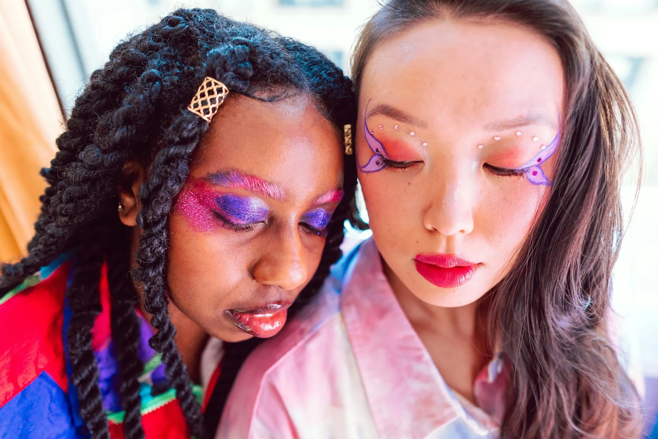 Two Friends Posing Close Together in a Colorful Outfits