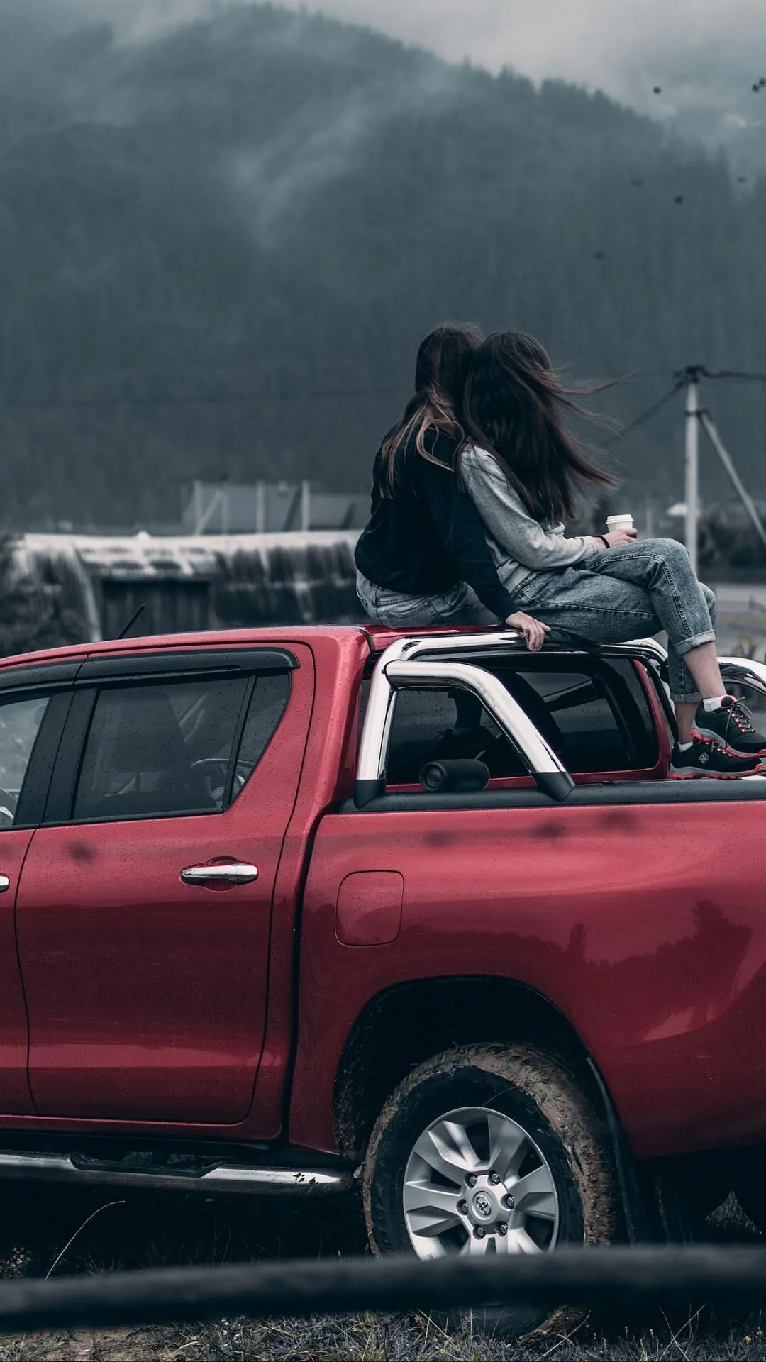 Two Girls Sitting on a Red Suv Roof Free Desktop Wallpaper