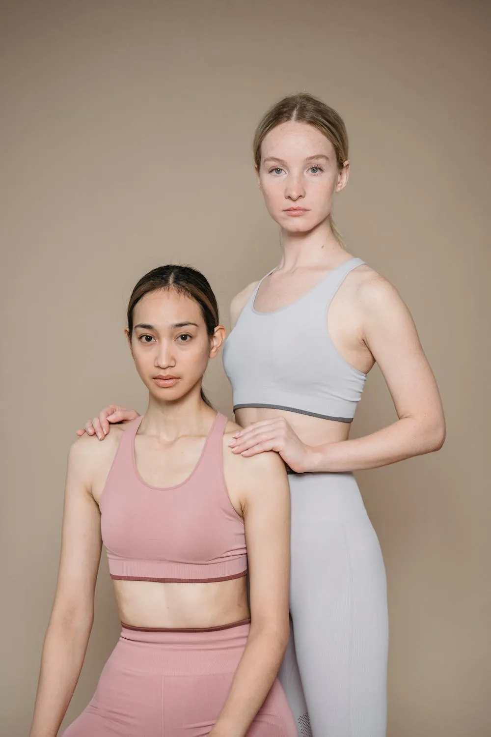 Two Stylish Women Posing in a Modern Fashion Studio Shoot