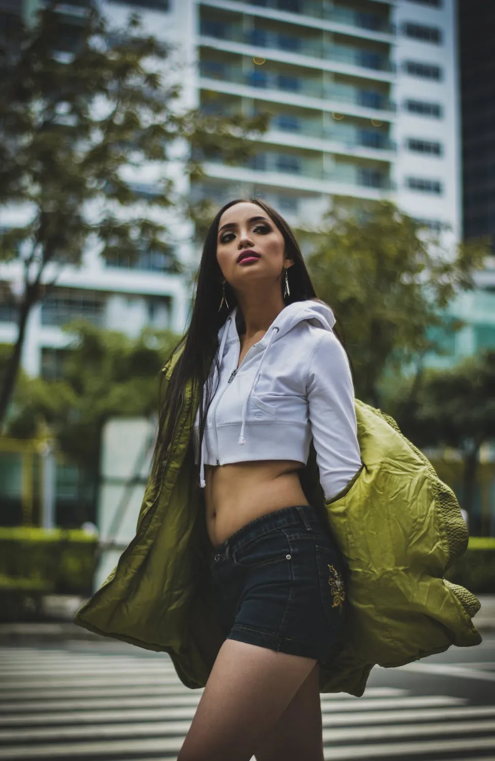 Urban Fashion Model Walking Confidently Near the Buildings