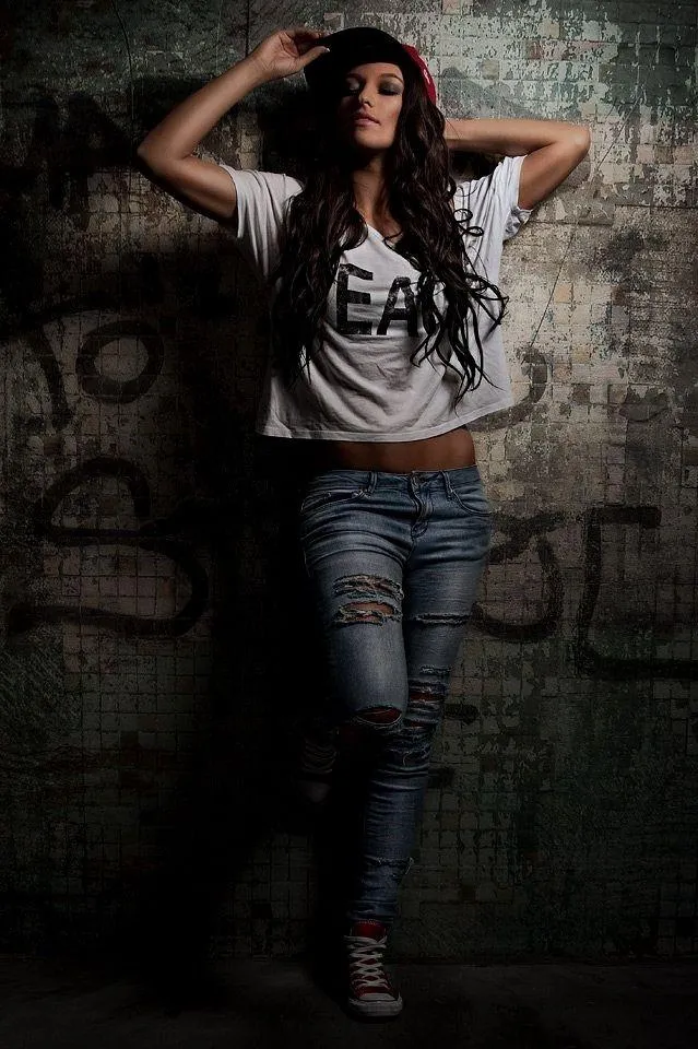 Urban Fashion Shoot of Model in Ripped Jeans and Graphic Tee
