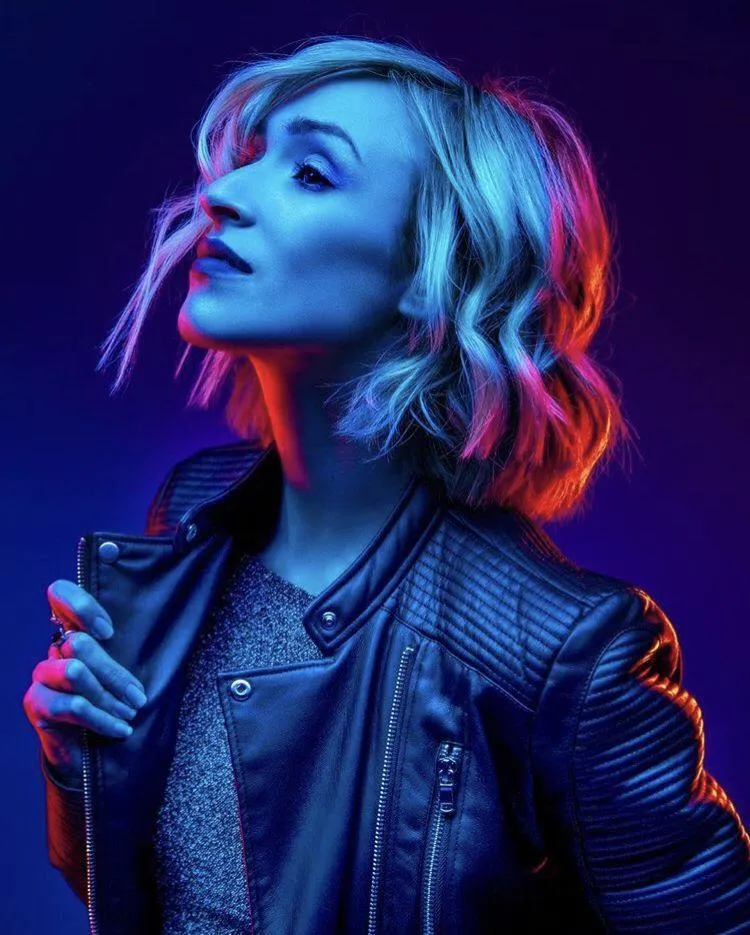 Vibrant Neon Portrait of a Woman with Short Colored Hair