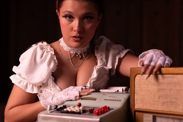 Vintage Style Model with Makeup Posing Beside a Wooden Table