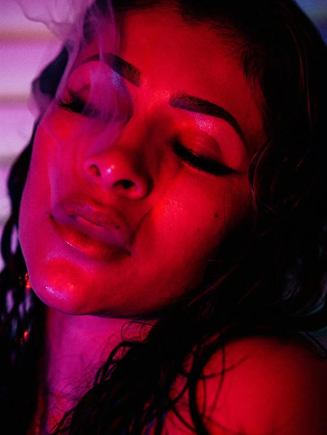 Wet Look Close Up of a Woman with a Dramatic Red Lighting