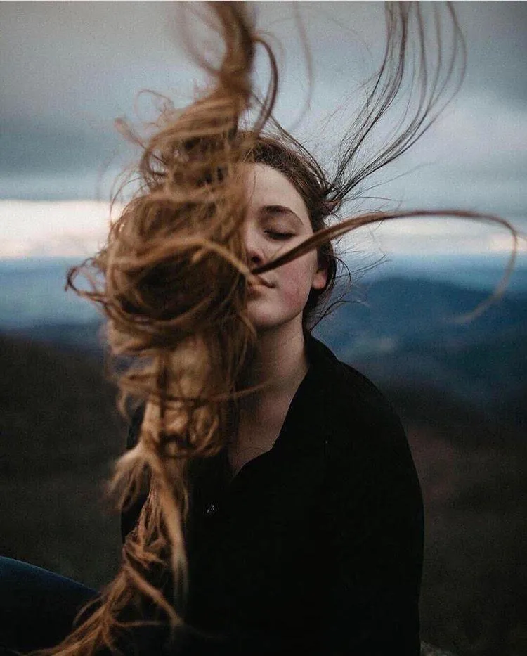 Wind Blowing Through a Womans Hair in a Dramatic Portrait