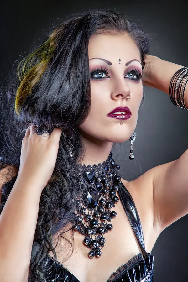 Woman in a Black Choker and Makeup Posing Confidently Image