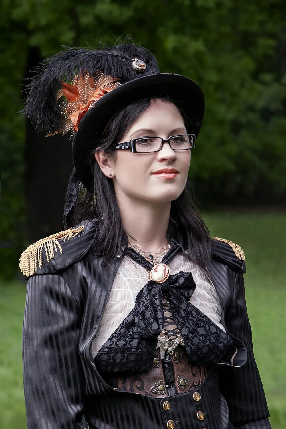 Woman in a Black Hat with a Gothic Outfit Posing Outdoors