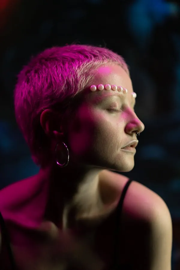 Woman with Buzz Cut and Pearls in a Glowing Studio Light