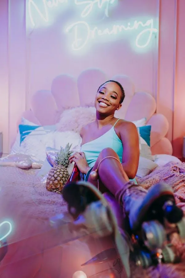 Woman in a Dreamy Pink Room Posing with Soft Expression