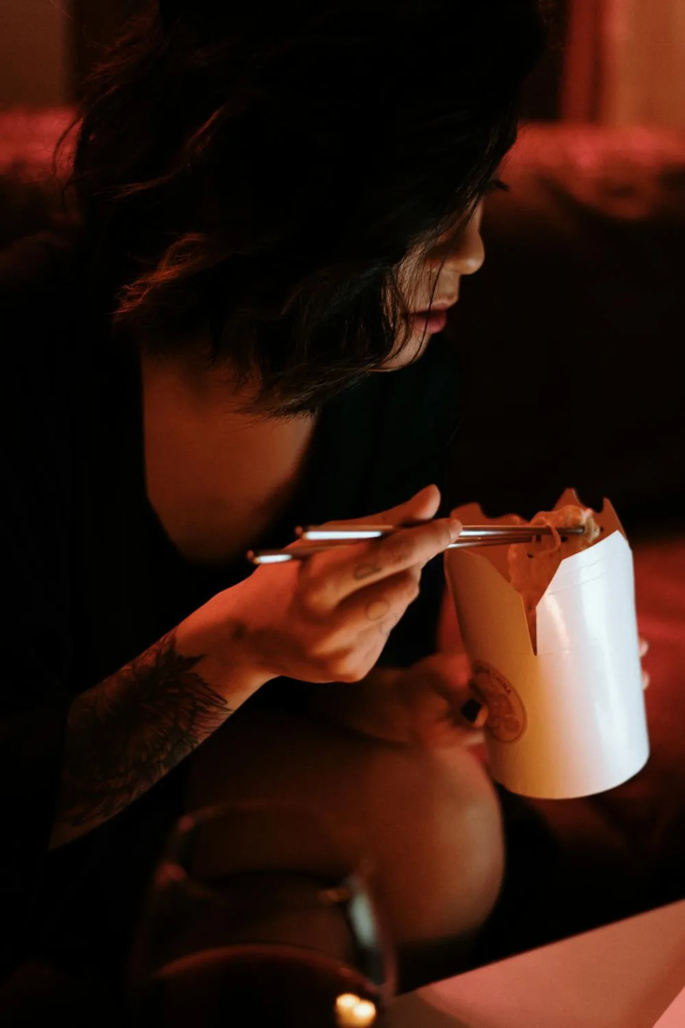 Woman Enjoying a Calm Moment with Candlelight in the Evening