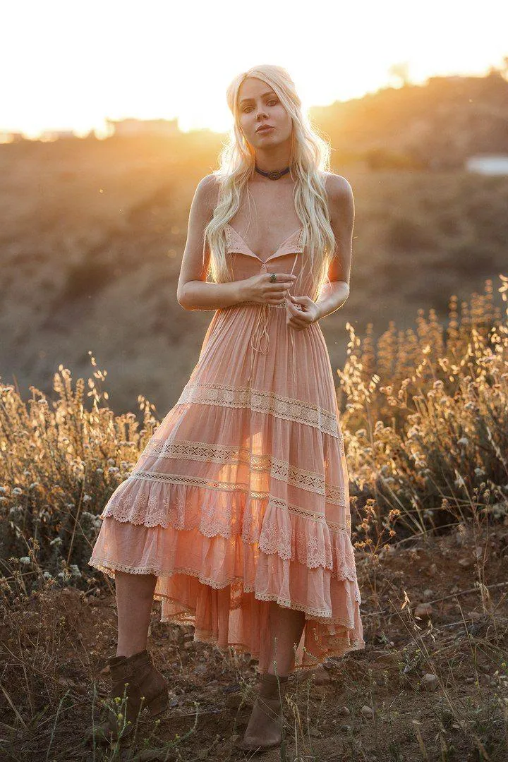 Woman in a Flowing Dress in Warm Sunset Field Glow Wallpaper