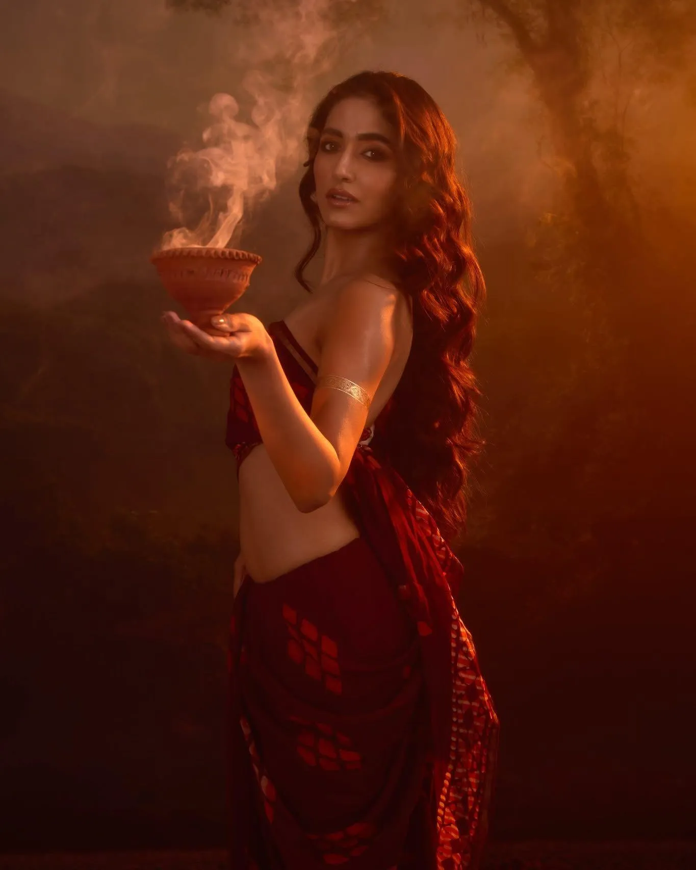 Woman Holding a Bowl with Dramatic Lighting and a Red Outfit