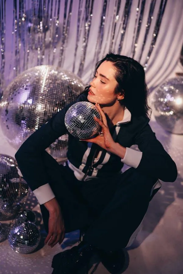 Woman Holding Disco Balls in a Shiny Festive Party Scene