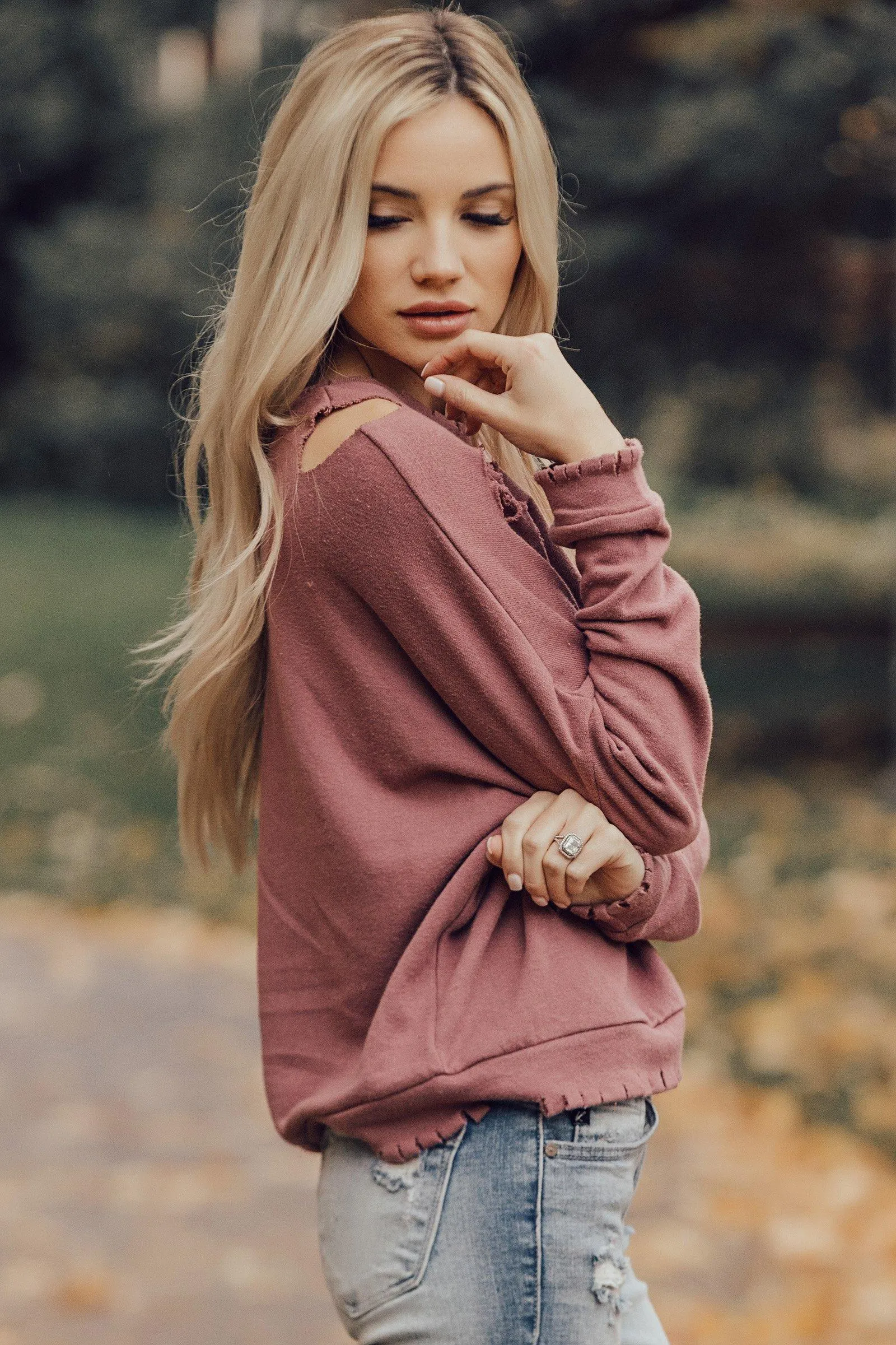 Woman in a Leather Jacket Posing Confidently Indoors Image