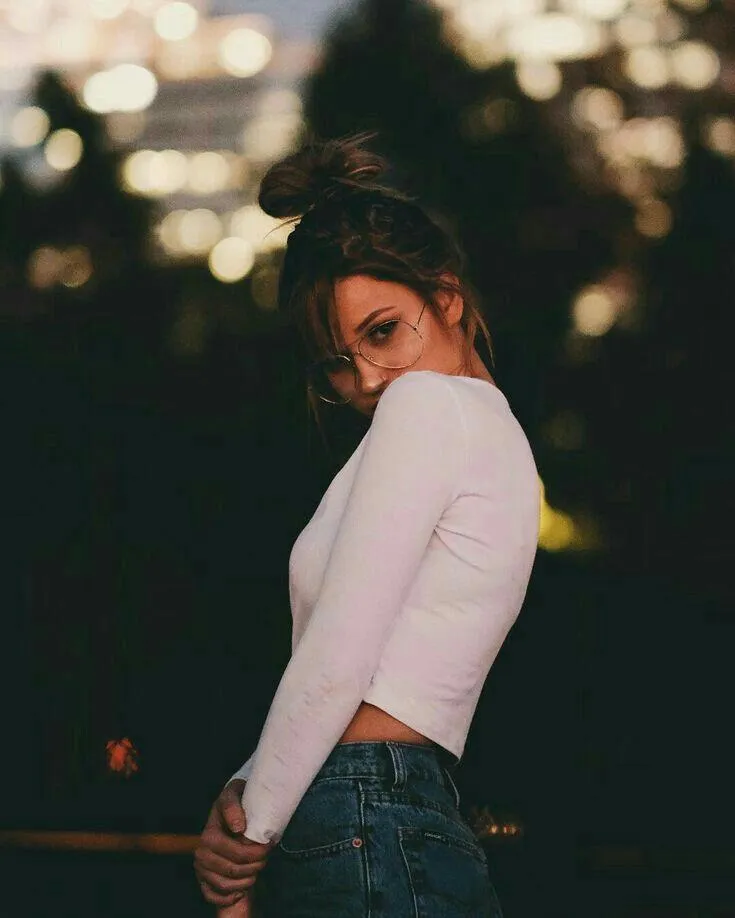 Woman in Leather Jacket with Wind Blowing Through Her Hair