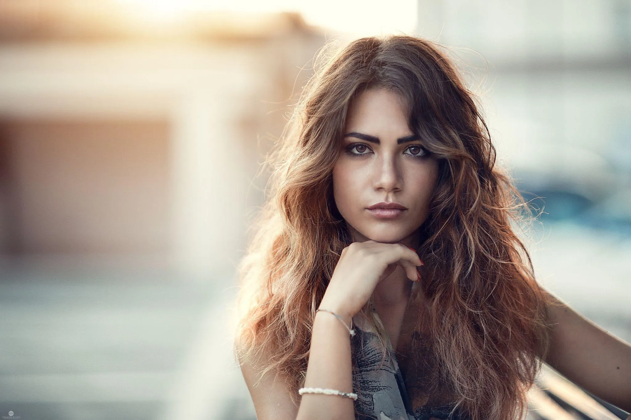 Woman Lying on Autumn Leaves Smiling At the Camera Wallpaper