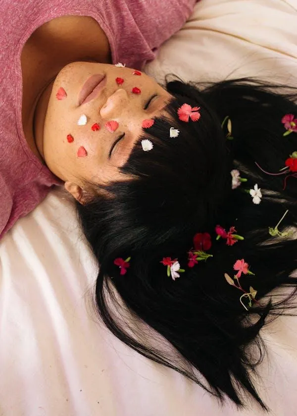 Woman Lying Down with Flower Petals on Her Face Hd Wallpaper