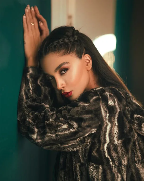 Woman Model in Animal Print Coat Posing Dramatically Indoors
