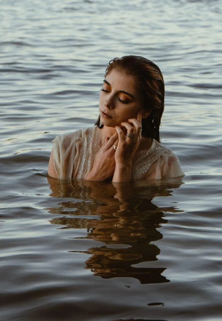 Woman Model Is Submerged in Water Looking To the Side Image