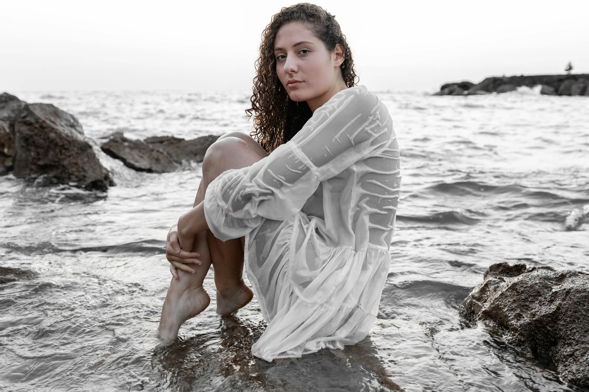 Woman Model in a White Shirt Enjoying a Peaceful Beach View